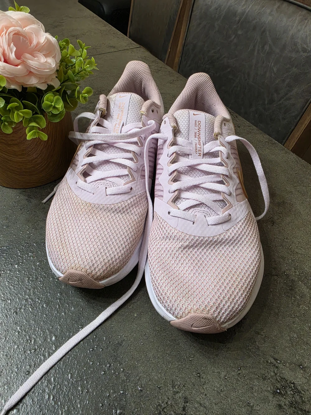 Nike Women’s Light Pink Running Shoes with Gold Swoosh